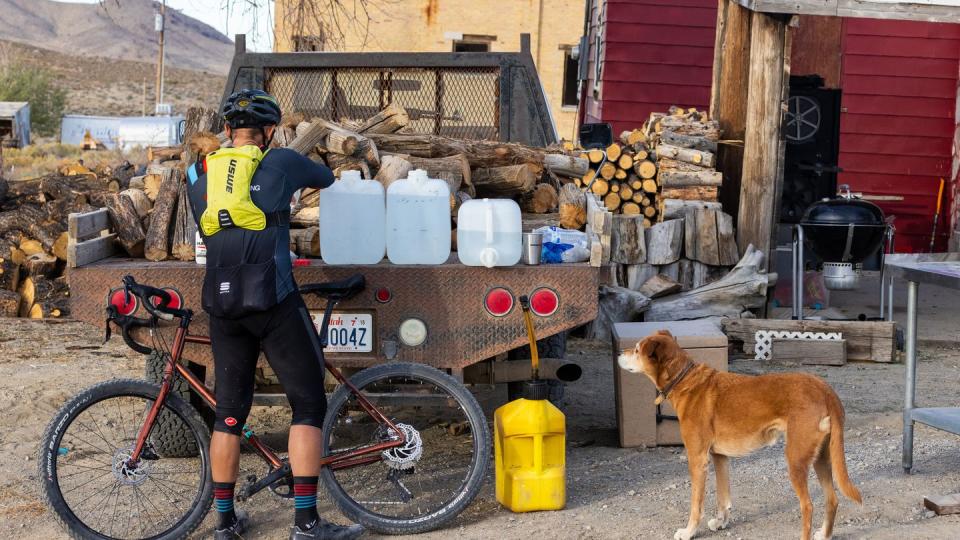 a salty pony rider fills his bottles at the gold hill aid station