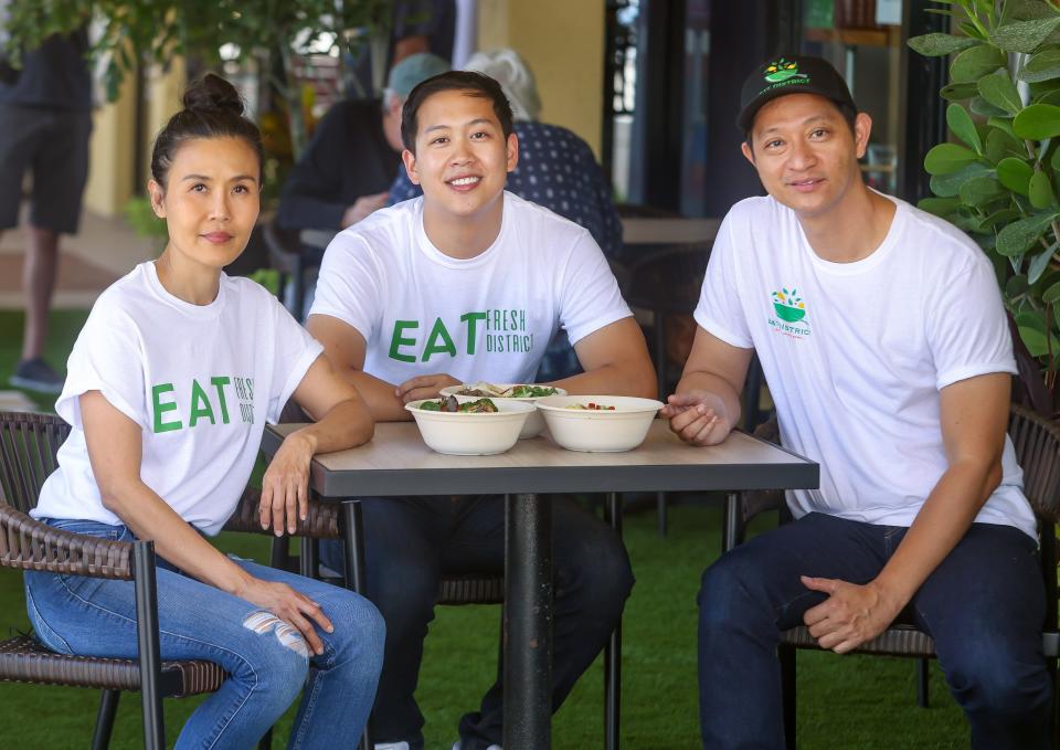 Urban Belly restaurant group's Art Piyavichayanont, at right, with nephew Louis Grayson and family friend Juanita "Da" Chatchonbutr at Eat District, a build-your-own bowl restaurant at the Fifth Avenue Shops plaza in Boca Raton.