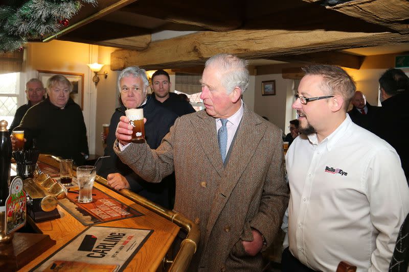 Britain's Prince Charles meets flood victims in Hare and Hounds pub in in Fishlake