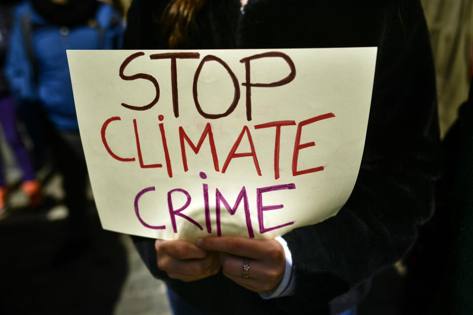 A student holds a banner during a demonstration against climate change in Pamplona, northern Spain, Friday March 15, 2019. Students mobilized by word of mouth and social media skipped class Friday to protest what they believe are their governments’ failure to take though action against global warming. (AP Photo/Alvaro Barrientos)