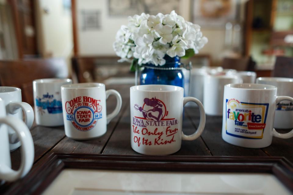 Iowa State Fair mugs donated by the family of Roger Horton sit on a table in the Historical Museum at the fairgrounds.