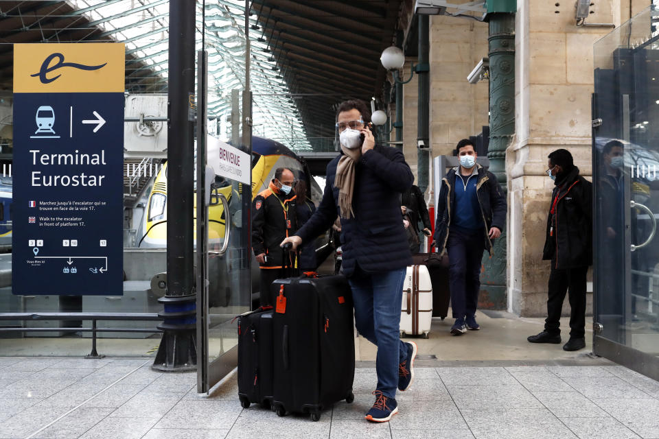 Passengers arrive with the first train arriving from Britain after Brexit, Friday Jan.1, 2021 at the Gare du Nord railway station, in Paris. Britain left the European bloc's vast single market for people, goods and services at 11 p.m. London time, midnight in Brussels, completing the biggest single economic change the country has experienced since World War II. (AP Photo/Thibault Camus)