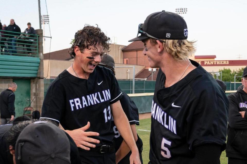 Franklin’s Nic Abraham (13) and Nolan Stevens (5) celebrate after winning the CIF Sac-Joaquin Section Division I high school baseball championship game against the Whitney Wildcats on Friday at Sacramento City College.