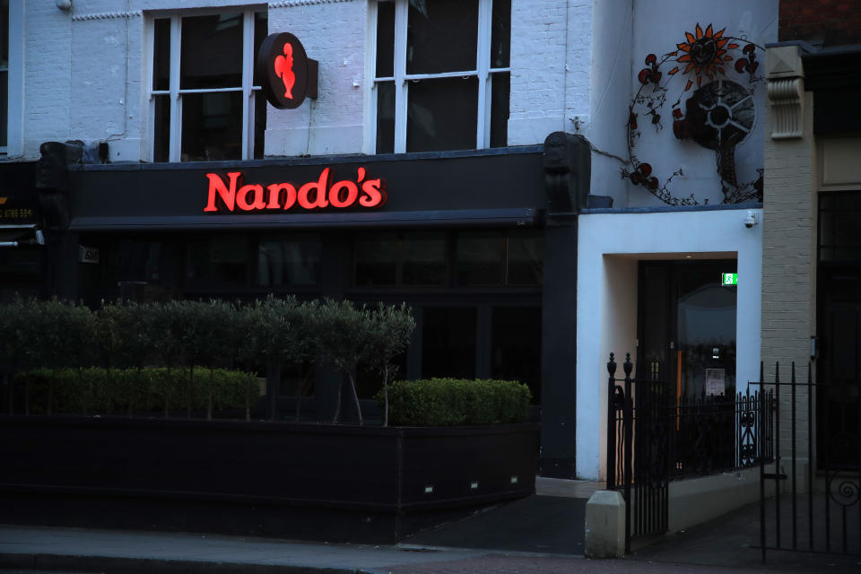 LONDON, ENGLAND  - MARCH 22: The closed East Putney Nando's restaurant is pictured on March 24, 2020 in London, England. Coronavirus (COVID-19) has spread to at least 195 countries, claiming over 16,500 lives and infecting over 380,000 people. There have now been 6,650 diagnosed cases in the UK and 335 deaths.  (Photo by Andrew Redington/Getty Images)