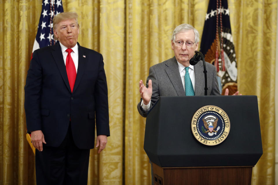 President Donald Trump listens as Senate Majority Leader Mitch McConnell of Ky., speaks in the East Room of the White House during an event about Trump's judicial appointments, Wednesday, Nov. 6, 2019, in Washington. (AP Photo/Patrick Semansky)