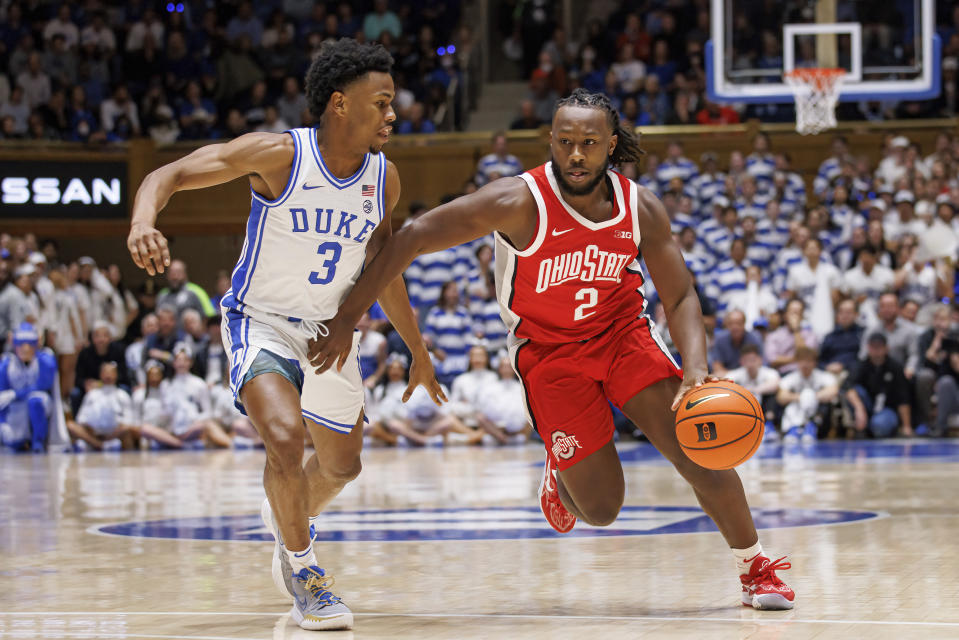 Ohio State's Bruce Thornton (2) handles the ball as Duke's Jeremy Roach (3) defends during the first half of an NCAA college basketball game in Durham, N.C., Wednesday, Nov. 30, 2022. (AP Photo/Ben McKeown)