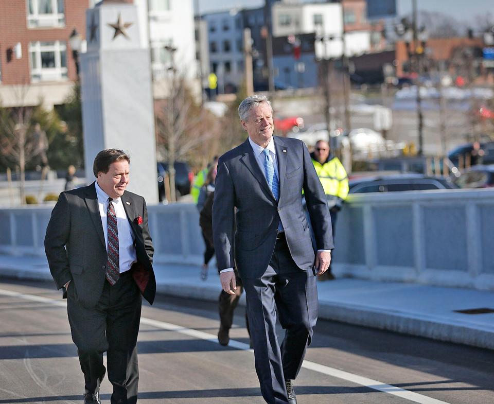 Governor Charlie Baker helps Quincy Mayor Tom Koch open the Generals Bridge in Quincy Center on Thursday, Jan. 13, 2022.