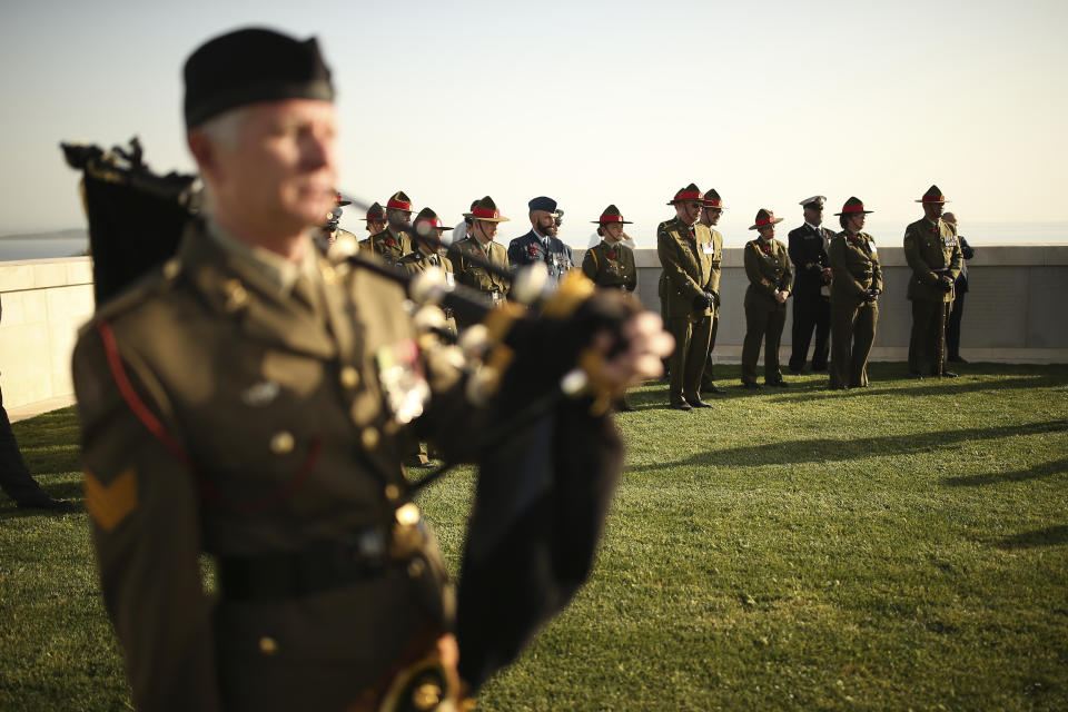 British, Australian and New Zealand soldiers attend a ceremony at the Helles Memorial in the Gallipoli peninsula, Turkey, Sunday, April 24, 2022. The annual Anzac Day ceremony on Monday, April 25 remembers the forces of the Australian and New Zealand Army Corps under British command in World War I who fought a bloody nine-month battle against Turkish forces on the Gallipoli peninsula in 1915. (AP Photo/Emrah Gurel)