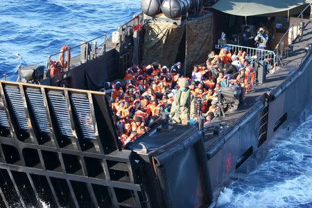 Migrants travel by landing craft before embarking on HMS Bulwark after being rescued from the Mediterranean between Italy and North Africa May 13, 2015. REUTERS/Crown Copyright/Jamie Weller/Handout via Reuters