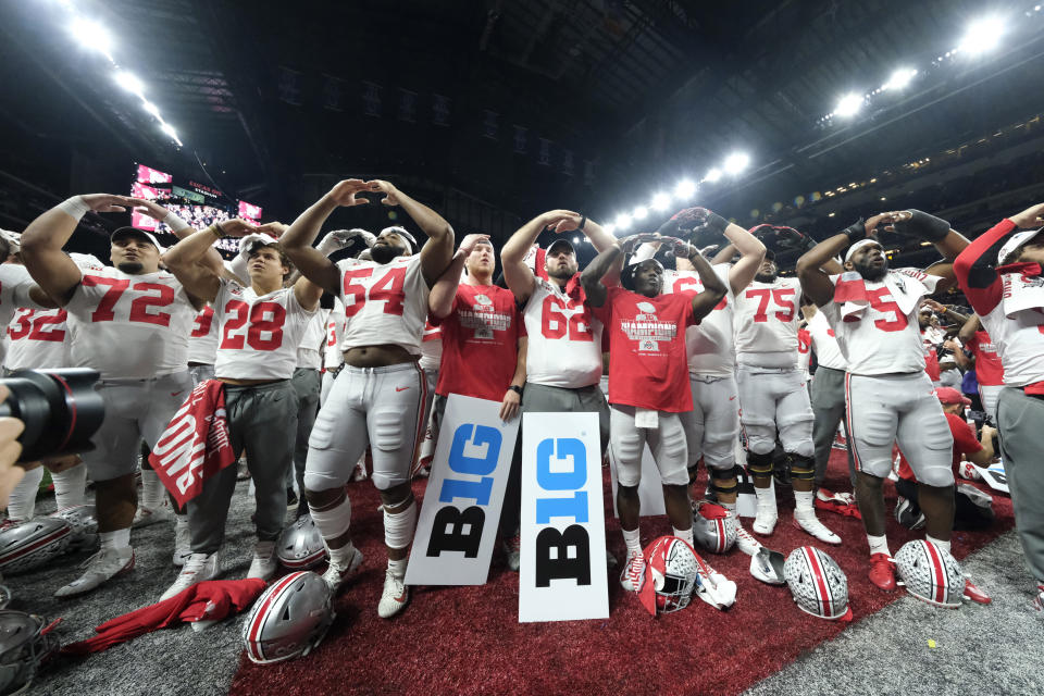 Ohio State players celebrate the team's 34-21 win over Wisconsin in the Big Ten championship NCAA college football game, early Sunday, Dec. 8, 2019, in Indianapolis. (AP Photo/AJ Mast)