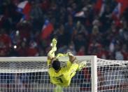 Chile's goalie Claudio Bravo climbs onto the goal after defeating Argentina to wint the Copa America 2015 at the National Stadium in Santiago, Chile, July 4, 2015. REUTERS/Henry Romero -