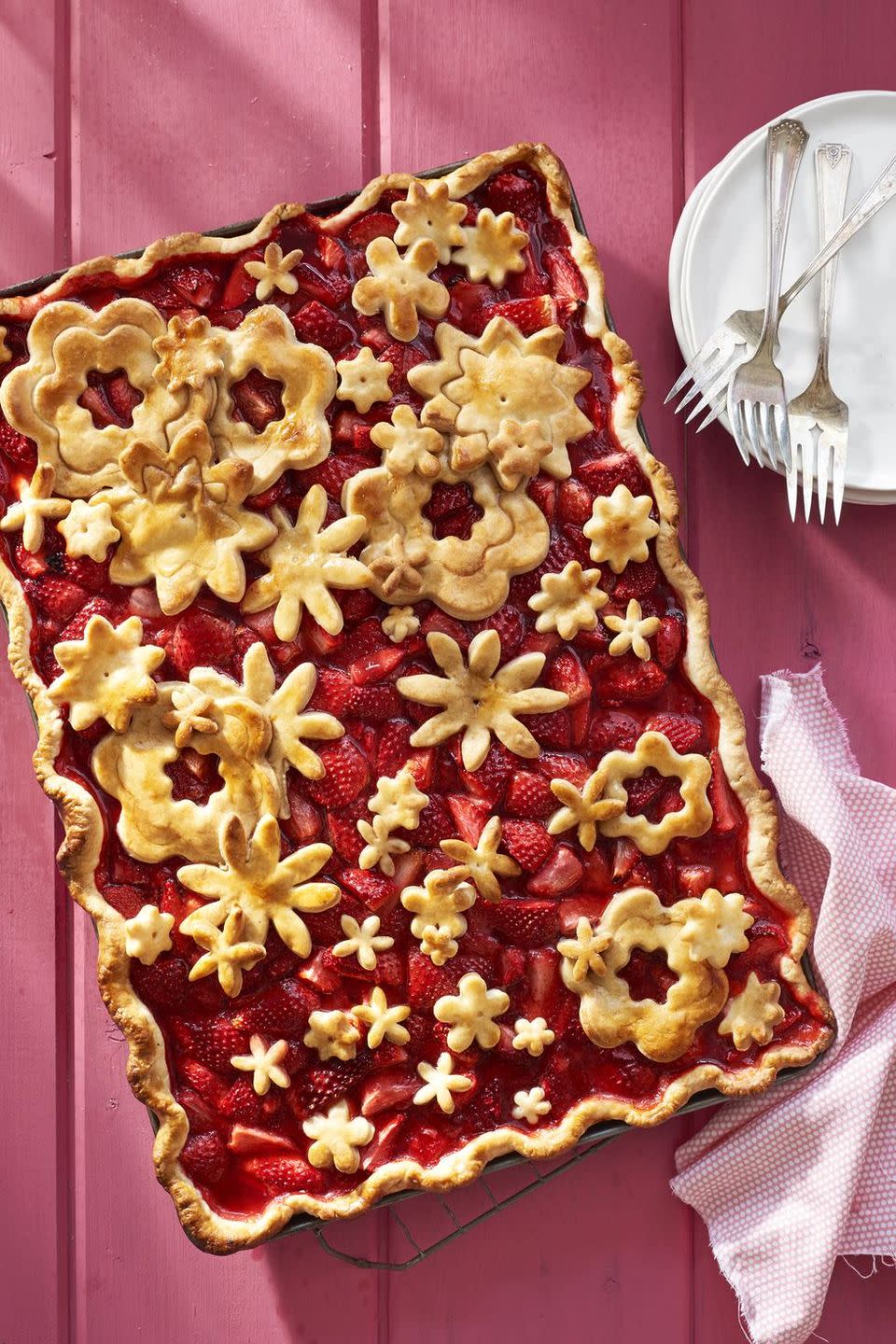 <p>Cutting out flower-shaped pieces of dough to place on top of these gorgeous strawberries makes a big impact (without a lot of time).</p><p><a href="https://www.countryliving.com/food-drinks/recipes/a41978/strawberry-slab-pie-recipe/" rel="nofollow noopener" target="_blank" data-ylk="slk:Get the recipe at Country Living »;elm:context_link;itc:0;sec:content-canvas" class="link "><em>Get the recipe at Country Living</em> <strong>»</strong></a></p>