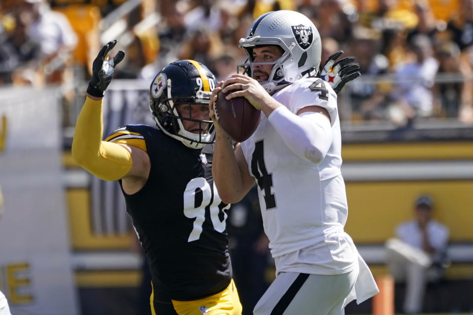 Pittsburgh Steelers outside linebacker T.J. Watt (90) pressures Las Vegas Raiders quarterback Derek Carr (4) during the first half of an NFL football game in Pittsburgh, Sunday, Sept. 19, 2021. (AP Photo/Keith Srakocic)