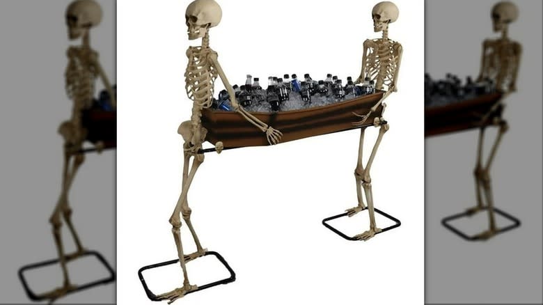 skeletons carrying coffin with bottles