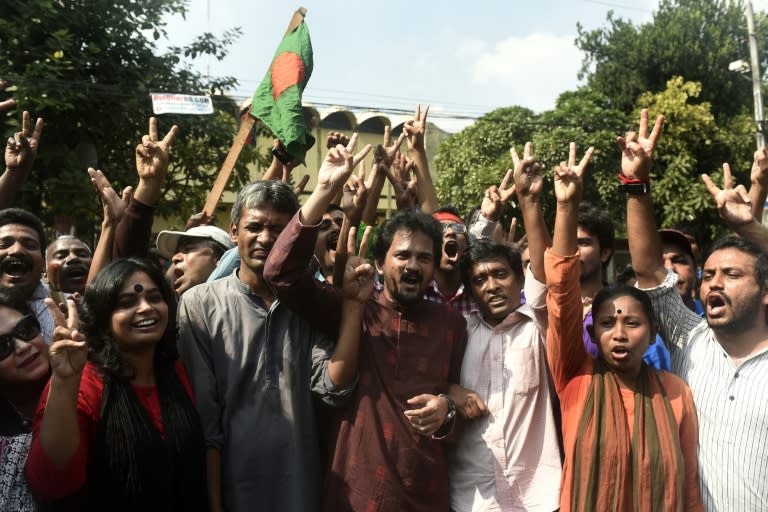 Bangladeshi activists celebrate after the sentencing of Jamaat-e-Islami party leader Mir Quasem Ali in Dhaka, on November 2, 2014