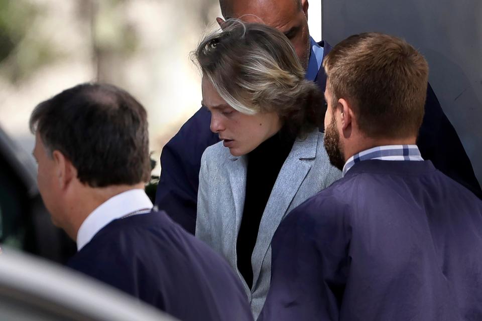 Michelle Carter, center, departs following a parole hearing on Sept. 19, 2019, in Natick, Mass.