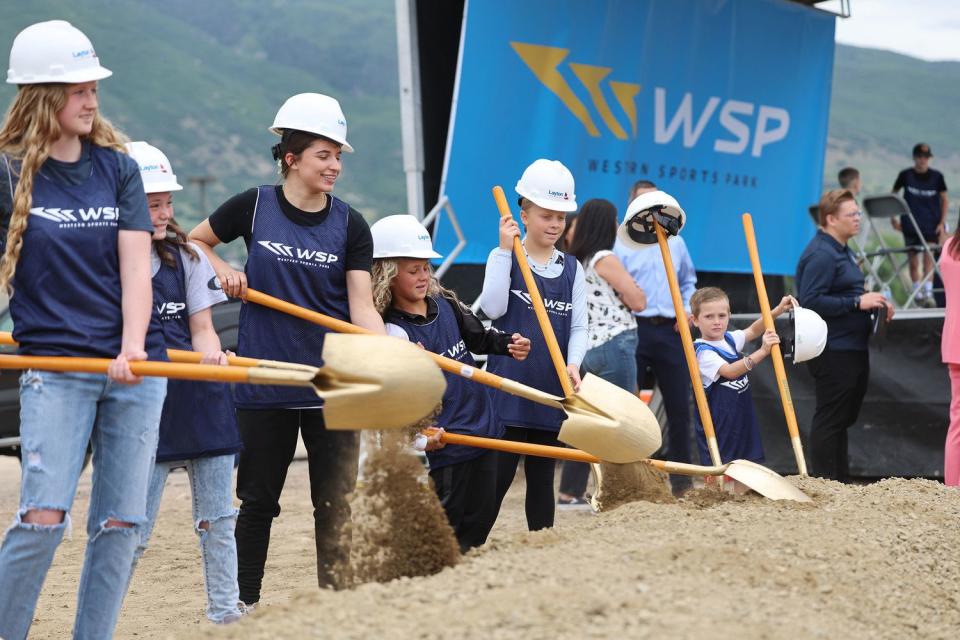 Kids from the Davis County area take a turn tuning dirt at a groundbreaking event for a new sports facility in Farmington on Tuesday. The state-of-the-art facility aims to expand sports tourism in Davis County.