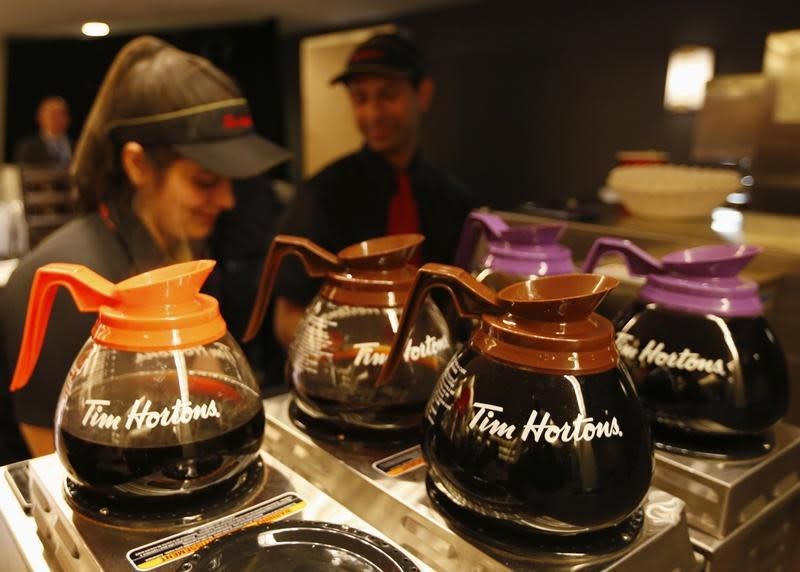 Tim Hortons employees prepare coffee before the company's annual general meeting in Toronto, May 8, 2014. REUTERS/Peter Jones  