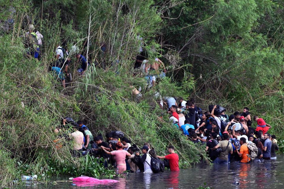 May 9, 2023:  Migrant people cross through the banks of the Rio Grande to the US, as seen from Matamoros, state of Tamaulupas, Mexico. A surge of migrants is expected at the US-Mexico border cities as President Biden's administration is officially ending its use of Title 42. On May 11, President Joe Biden's administration will lift Title 42, the strict protocol implemented by previous president Donald Trump to deny entry to migrants and expel asylum seekers based on the Covid pandemic emergency.