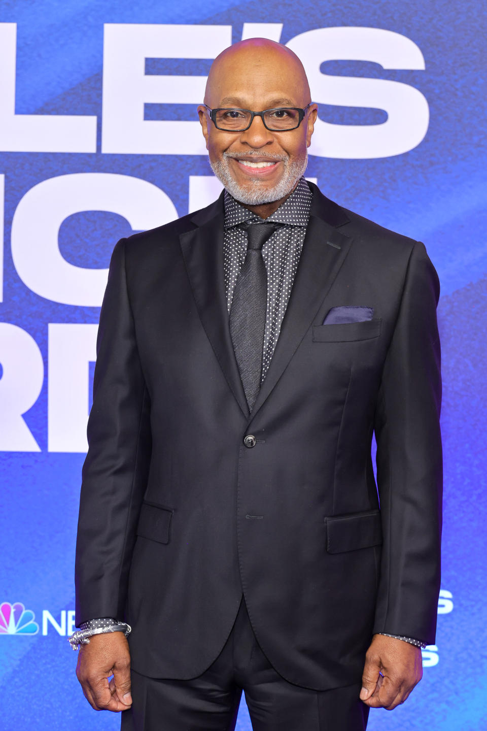 James Pickens Jr. weaars black suit with gray shirt