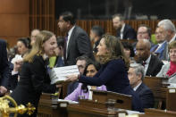 Canada's Deputy Prime Minister and Minister of Finance Chrystia Freeland, center, tables the federal budget in the House of Commons in Ottawa, Ontario, on Tuesday, April 16, 2024. The Liberal government has already unveiled significant planks of the budget, including billions of dollars to build more homes, expand child care and beef up the military. (Adrian Wyld/The Canadian Press via AP)