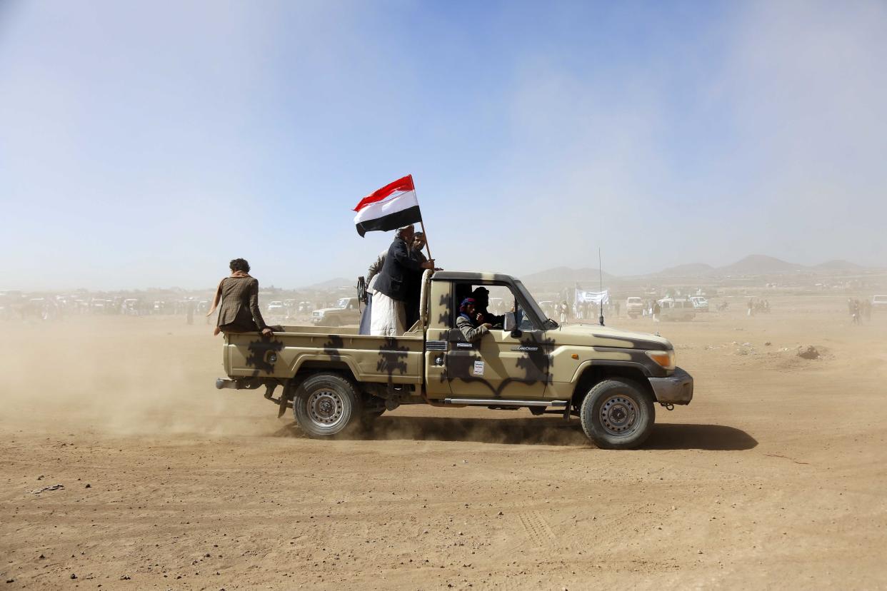 SANAA, YEMEN - JANUARY 14: Members of different tribes shout anti-US slogans with guns in hands as they stage a protest against United States' attacks on Yemen's Houthis near Sanaa, Yemen in January 14, 2024. (Photo by Mohammed Hamoud/Anadolu via Getty Images)