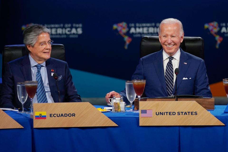 President Joe Biden, center, sits beside Ecuador President Guillermo Lasso, left, during a leaders retreat and working luncheon with heads of state and government at the Summit of the Americas, June 10, 2022, in Los Angeles. Biden will meet this coming Monday, Dec. 19, with Lasso at the White House. (AP Photo/Evan Vucci, File)