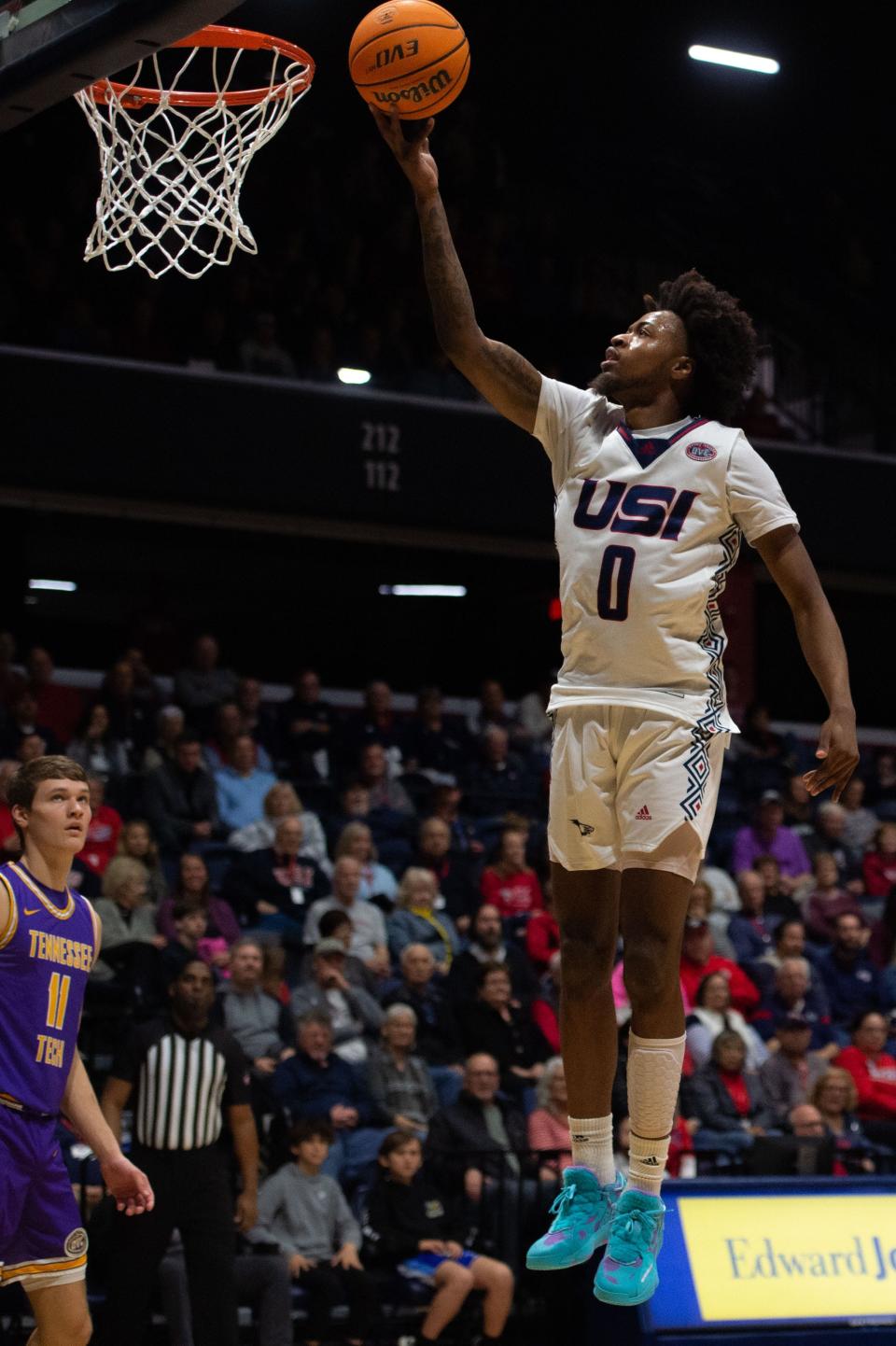 Southern Indiana’s Jelani Simmons (0) leaps for a basket against the Tennessee Tech Golden Eagles during a match held at University of Southern Indiana on Thursday, Feb. 23, 2023.