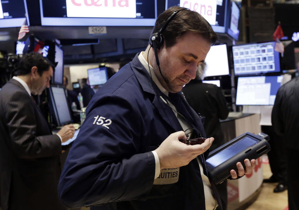 Traders work on the floor of the New York Stock Exchange, Thursday, April 3, 2014. Stocks indexes are edging higher as investors become more optimistic about the outlook for the U.S. economy. (AP Photo/Richard Drew)
