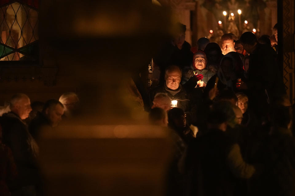 Orthodox believers walk with candles around a church during Orthodox Easter midnight service in St. Petersburg, Russia, Sunday, May 5, 2024. Eastern Orthodox churches observe the ancient Julian calendar and this year celebrate Orthodox Easter on May 5. (AP Photo/Dmitri Lovetsky)