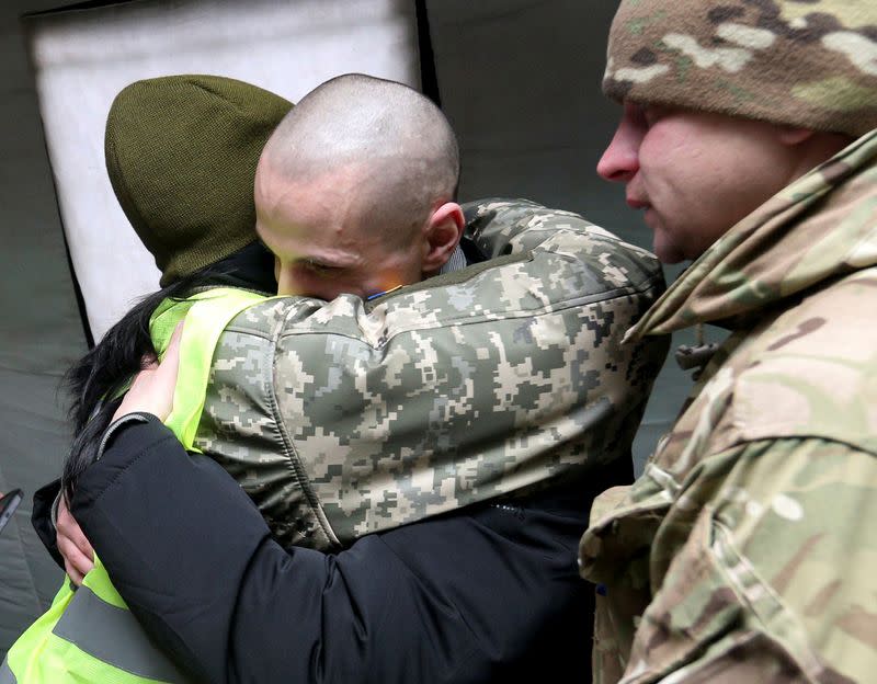 A Ukrainian citizen is welcomed following the exchange of prisoners of war between Ukraine and the separatist republics in Donetsk region