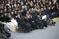 People wounded in the Paris attacks and family members attend a ceremony to pay a national homage to the victims of the Paris attacks at Les Invalides monument in Paris, France, November 27, 2015. (REUTERS/Charles Platiau)