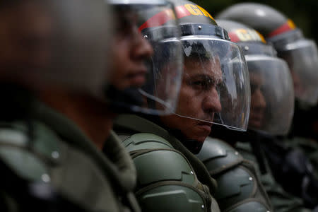 Venezuelan National Guards stand guard during clashes with opposition supporters at a rally to demand a referendum to remove President Nicolas Maduro in Caracas, Venezuela, May 18, 2016. REUTERS/Carlos Garcia Rawlins