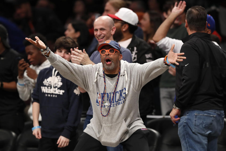 New York Knicks fan and film director Spike Lee reacts from his front-row seat during the second half of an NBA basketball game between the Brooklyn Nets and the Knicks, Friday, Oct. 25, 2019, in New York. (AP Photo/Kathy Willens)