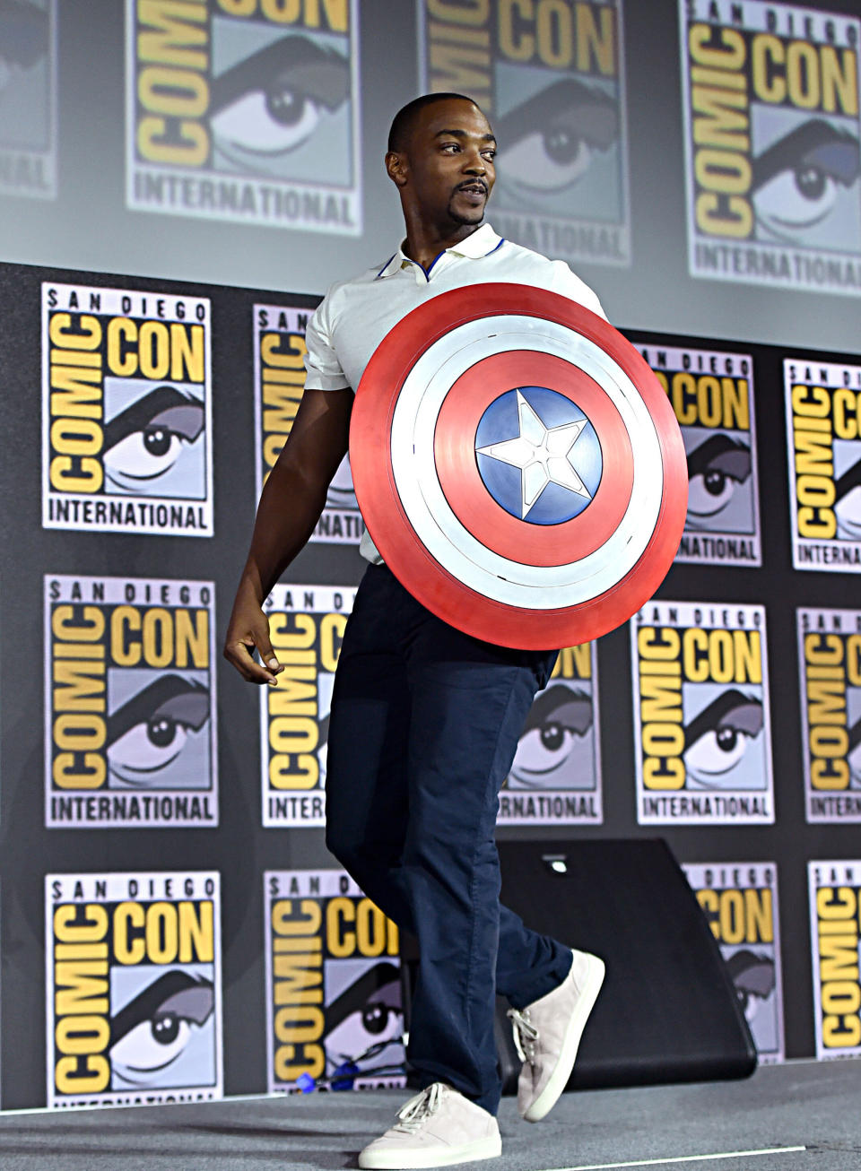 Anthony Mackie, who plays Falcon, carries Captain America's shield at the San Diego Comic-Con International 2019 Marvel Studios Panel. (Photo: Alberto E. Rodriguez via Getty Images)