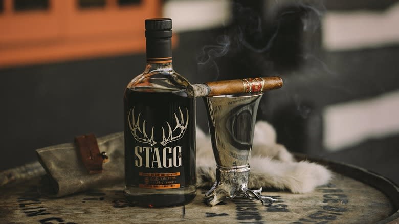 Stagg bourbon bottle with cigar