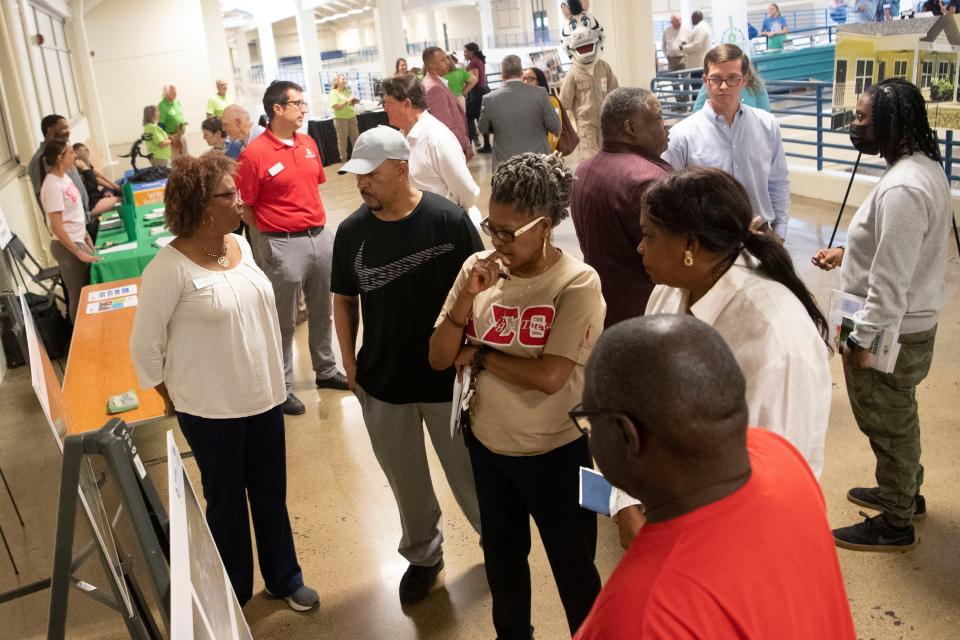 East Knoxville neighbors gather to ask questions about the BlueCross Healthy Place at Morningside Park, a substantial revamp of the park, which currently includes disc gold, a playground, exercise equipment and a grassy field at 1600 Dandridge Ave. New play equipment will be added, along with parking, a centralized adult exercise area, new covered picnic shelters and bathrooms.