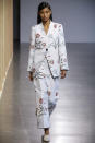 <p>Model wears a floral pantsuit at the fall 2018 Claudia Li show. (Photo: Getty Images) </p>