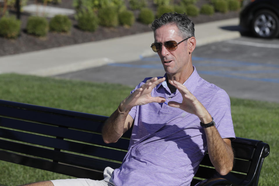 Randall Scott discusses the impeachment inquiry into President Donald Trump while sitting in a park in the Nickel Plate District, Wednesday, Oct. 9, 2019, in Fishers, Ind. (AP Photo/Darron Cummings)