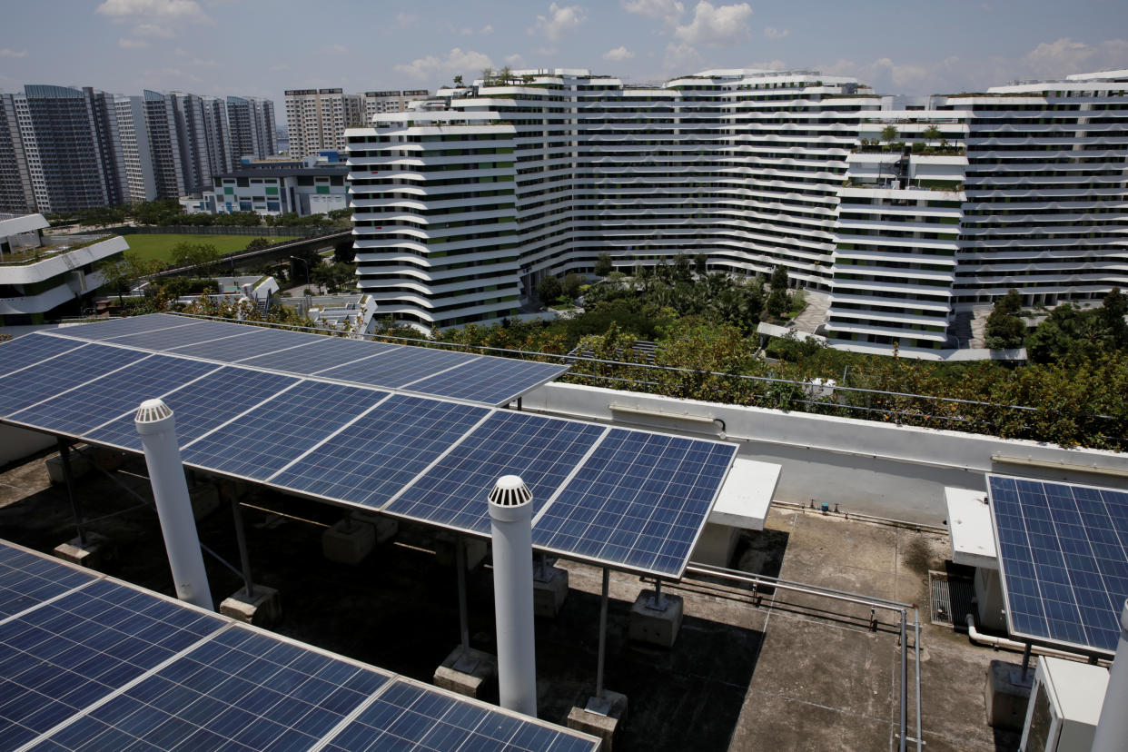 Solar panels are seen on the roof of a public housing block in Singapore September 23, 2018. Picture taken September 23, 2018.      REUTERS/Thomas White