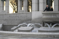 President Joe Biden and first lady Jill Biden visit the National World War II Memorial to mark the 80th anniversary of the Japanese attack on Pearl Harbor, Tuesday, Dec. 7, 2021, in Washington. (AP Photo/Evan Vucci)