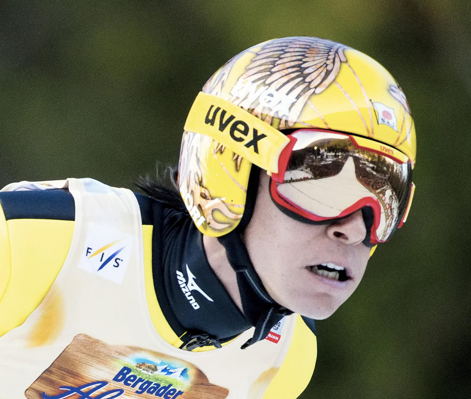 Fourth placed Noriaki Kasai of Japan soars through the air during the FIS World Cup ski jumping in Willingen, Germany, Sunday, Feb. 2, 2014. (AP Photo/Jens Meyer)