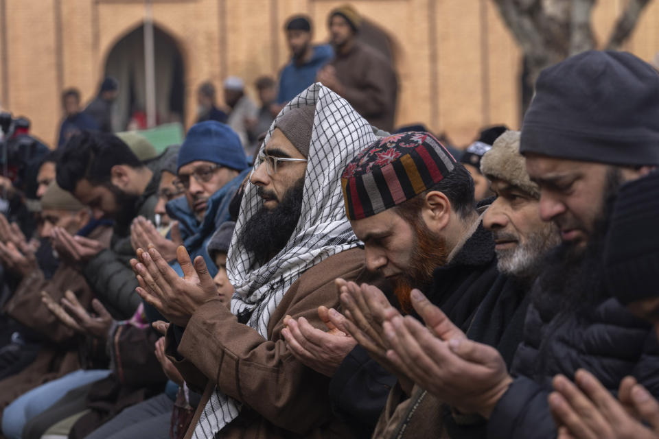 Kashmiris offer special prayers in the compound of Jamia Masjid or Grand Mosque in Srinagar, Indian controlled Kashmir, Friday, Jan. 12, 2024. Special congregational prayers known as "Salatul Istisqa" were organized by Anjuman Aquaf Jamia Masjid for respite from the prevailing dry weather conditions in Kashmir valley. (AP Photo/Dar Yasin)