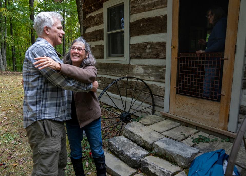 Jeff Stant, executive director at Indiana Forest Alliance, hugs Susan Hollis of Bloomington at her family cabin in a remote part of Brown County that would be part of Sen. Braun's expanded Charles C. Deam wilderness.