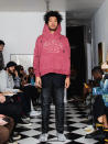 In this Friday, Sept. 13, 2019 photo provided by Bstroy, models at a show for fashion brand Bstroy wear hoodies emblazoned with the names of schools touched by mass shootings at an apartment in the Soho neighborhood of Manhattan in New York. The hoodies have created a backlash from critics who say they glamorize violence and aim to profit from tragedy. Bstroy co-founder Dieter Grams says the hoodies are an effort to bring attention to gun violence and are not for retail sale. (Bstroy via AP)