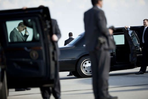 Members of the Secret Service wait after President Barack Obama arrived at an airport in March 2012. The US Secret Service, embroiled in a deepening sex scandal, said Saturday it had suspended 11 agents assigned to President Barack Obama's trip to Colombia amid reports they had used prostitutes