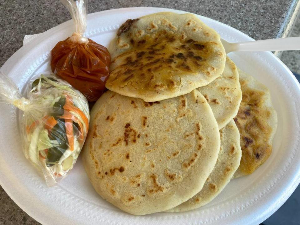 Pupusas with pickled cabbage and red sauce at Delicias Salvadorenas at 415 Green St. in Warner Robins.