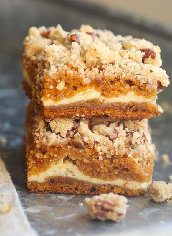 <p>Cookies and Cups</p><p>These cream cheese pumpkin praline bars are the perfect easy fall treat made from layers of moist pumpkin cake with a sugary cream cheese filling! </p><p><strong>Get the recipe: <em><a href="https://cookiesandcups.com/cream-cheese-filled-pumpkin-praline-bars/" rel="nofollow noopener" target="_blank" data-ylk="slk:Cream Cheese Pumpkin Praline Bars;elm:context_link;itc:0;sec:content-canvas" class="link rapid-noclick-resp">Cream Cheese Pumpkin Praline Bars</a></em></strong></p>