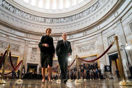 Senate Majority Leader Mitch McConnell, accompanied by an aide, walks through the Rotunda before the casket of U.S. Senator John McCain lies in state at the U.S. Capitol in Washington, U.S., August 31, 2018. Andrew Harnik/Pool via REUTERS