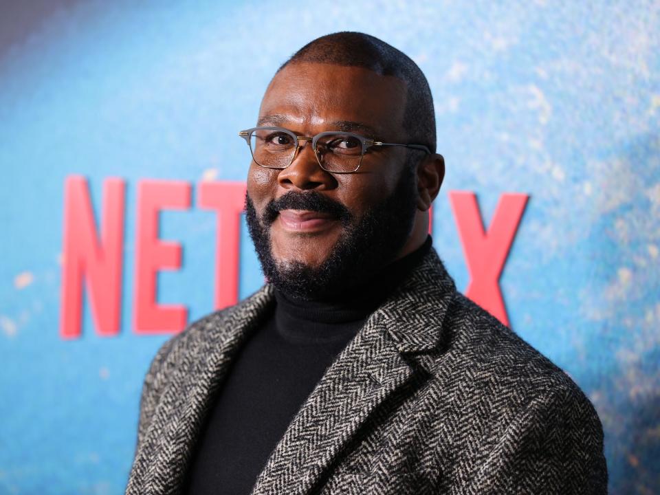 Tyler Perry in a gery jacket and black turtleneck